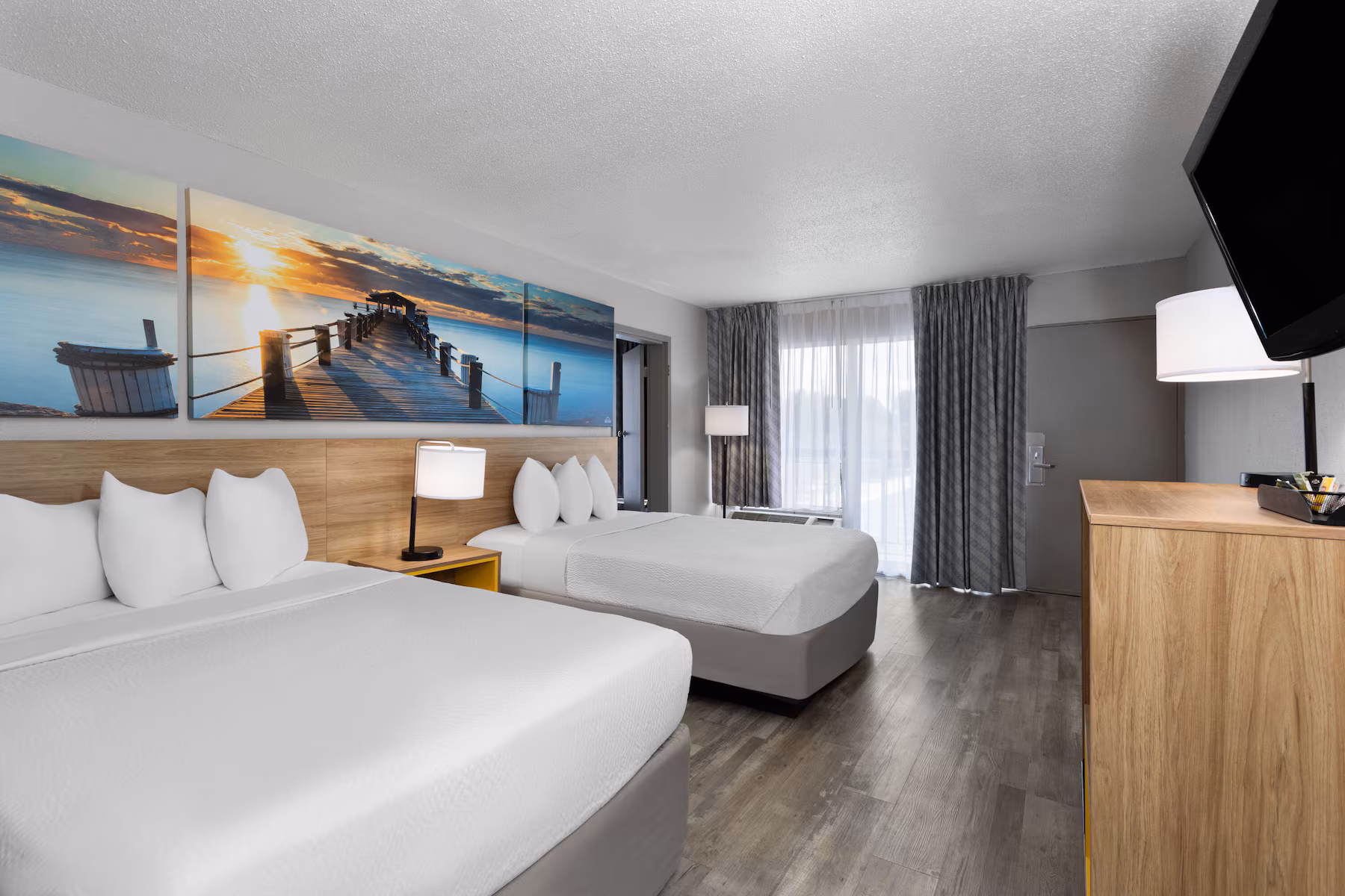 Suite with two beds, sofa and a separate work area